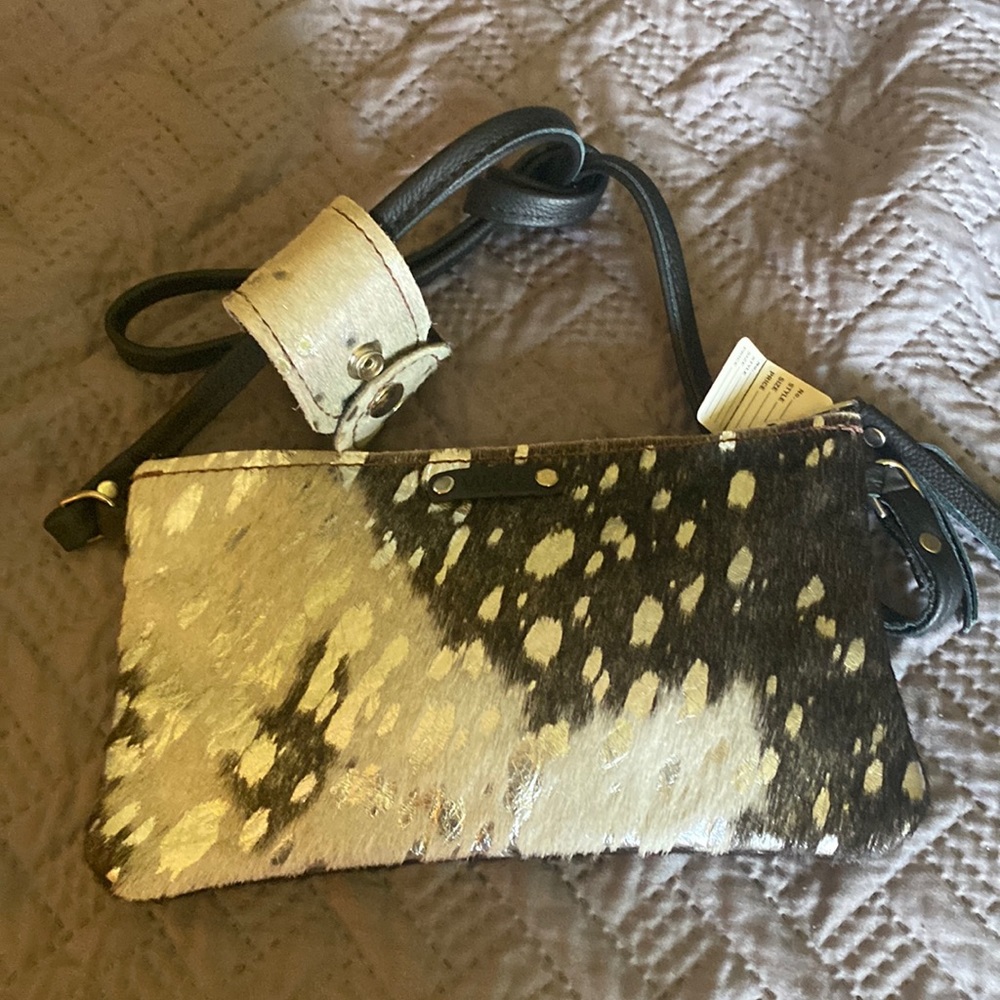 Adorable NWT black and silver calf hair crossbody bag with matching bracelet.